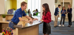 Thunderbird staff greet a visitor on the second floor reception area