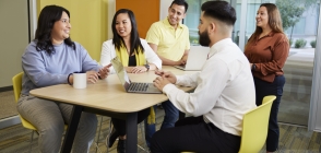 Thunderbird students and partners meet in One Global Place's global community room