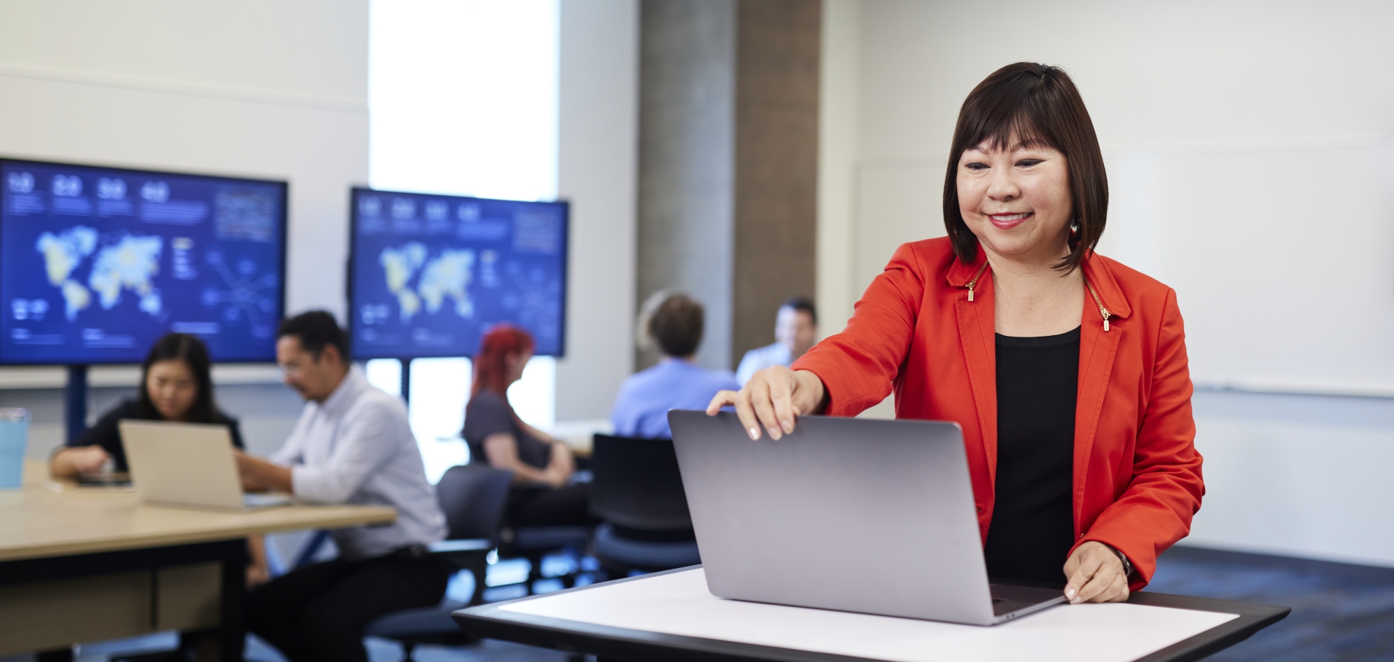 Thunderbird Senior Associate Dean and Professor Lena Booth teaching in a classroom