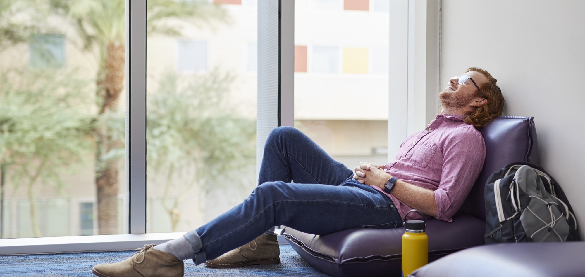 Thunderbird MGM student Sam Richardson relaxes in the meditation room at One Global Place