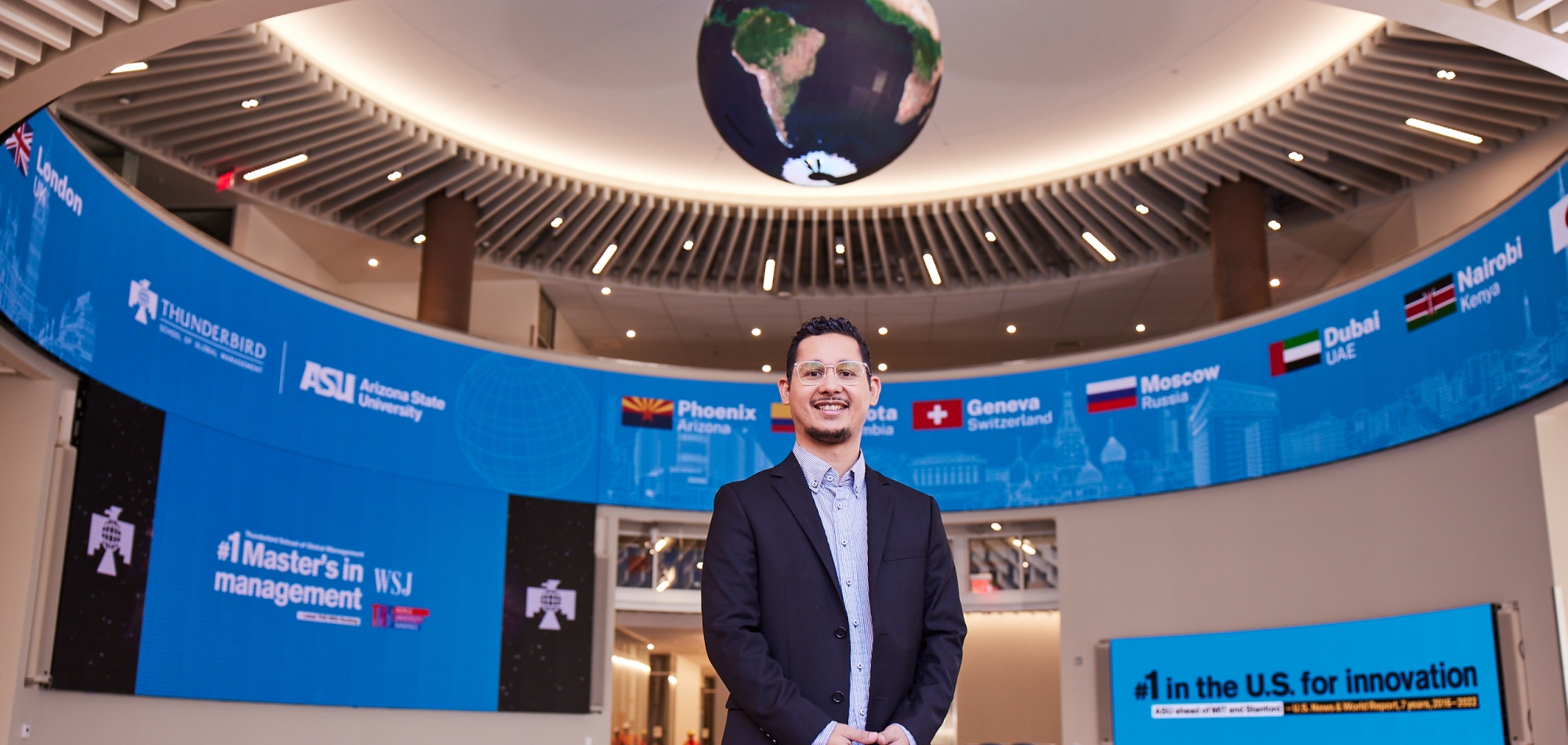 Thunderbird student Esly Diaz stands in the global forum in global headquarters