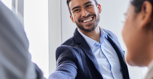 Concept of a business degree graduate shaking hands with interviewers