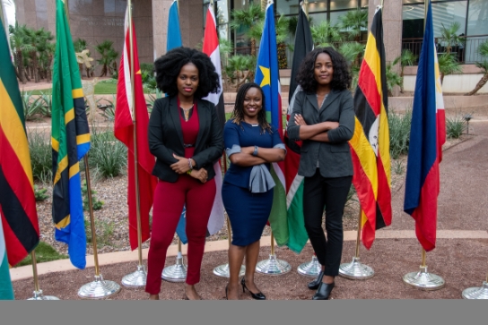 Image of Thunderbird students in front of international flags
